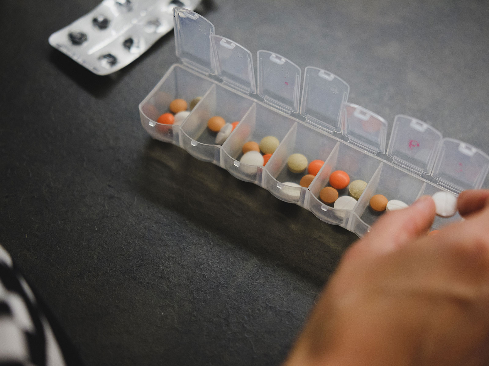 Pills of medicine in containers